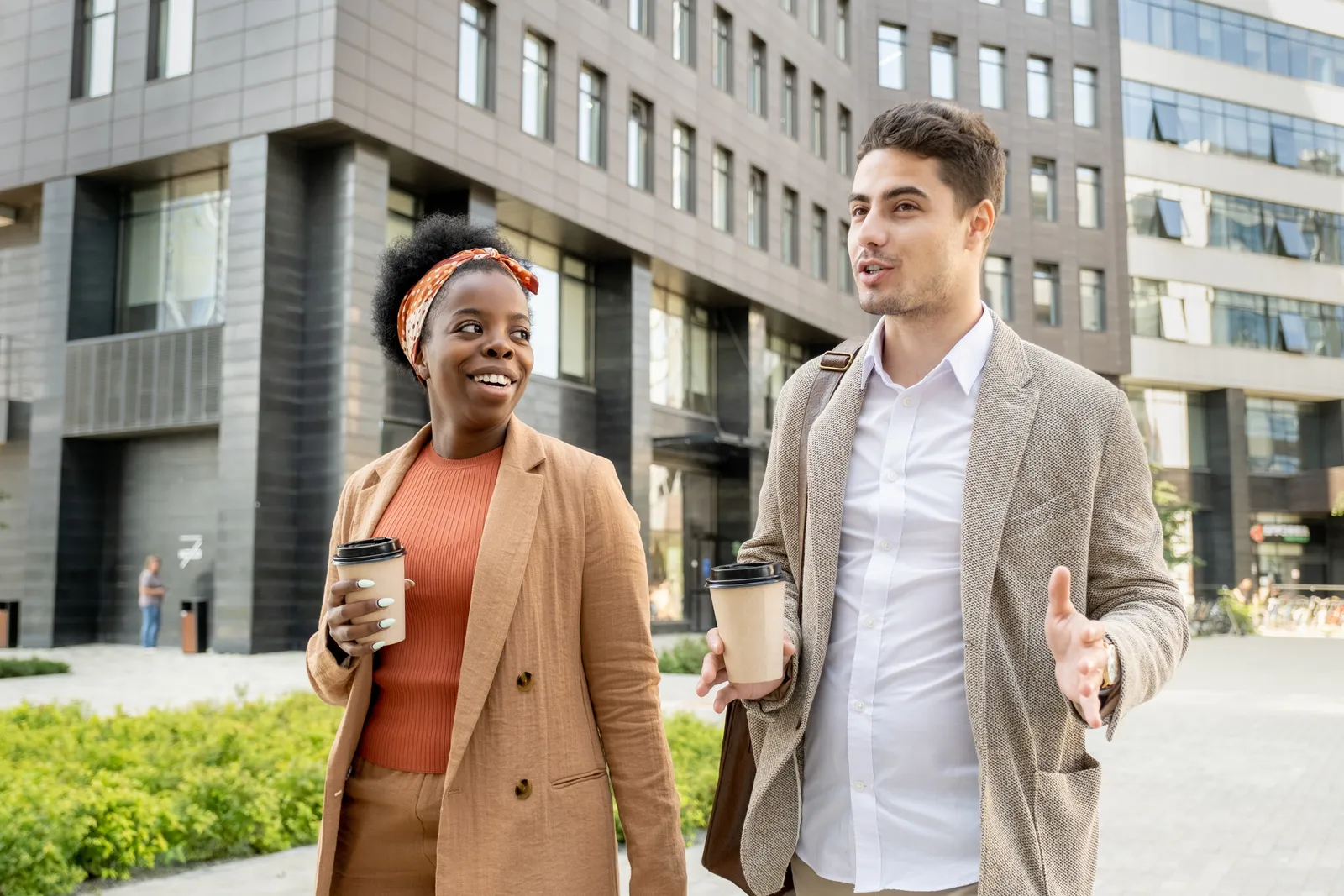 Two colleagues chatting on a walk through a London street