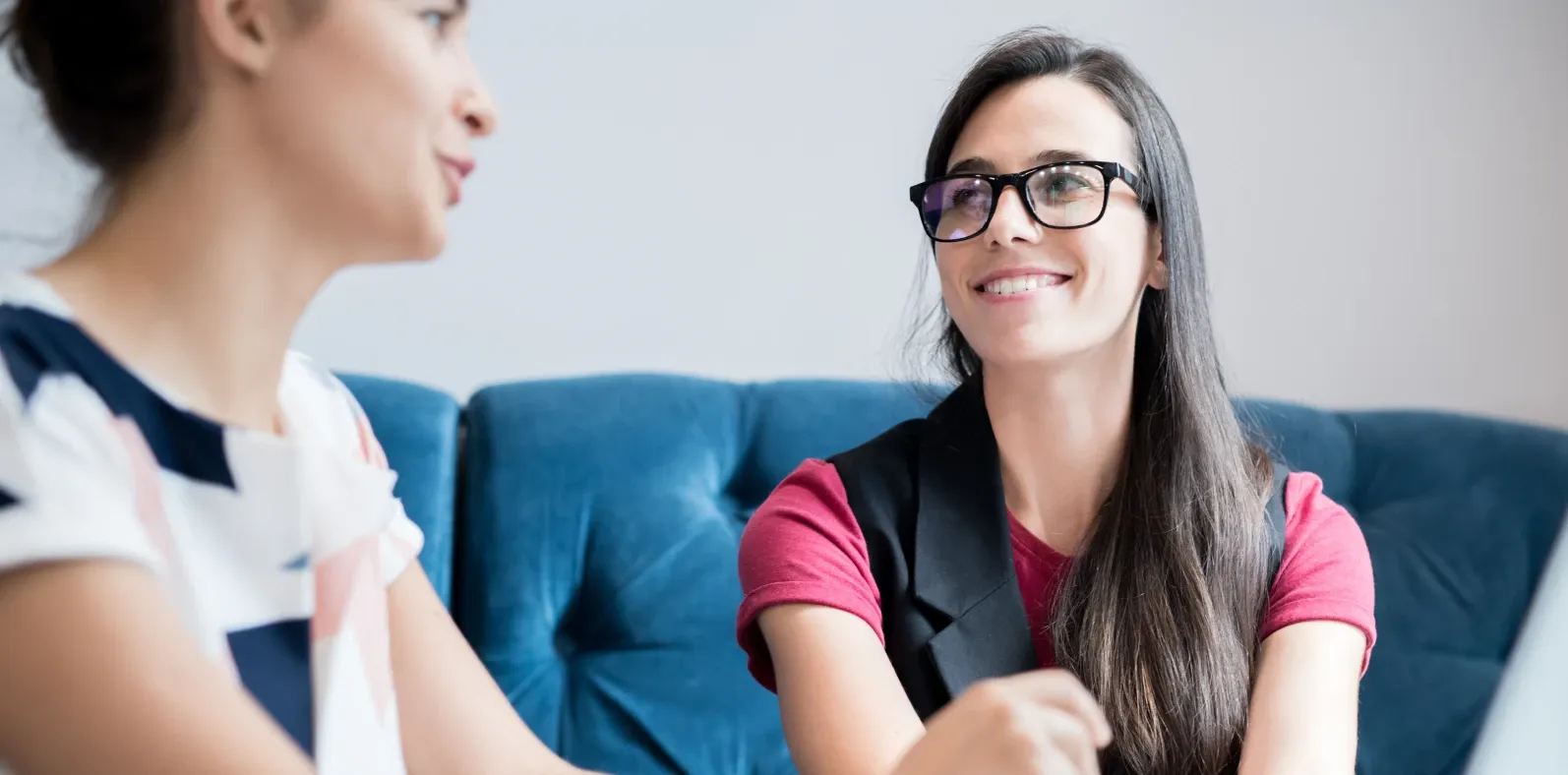A teacher listening closely as a student speaks