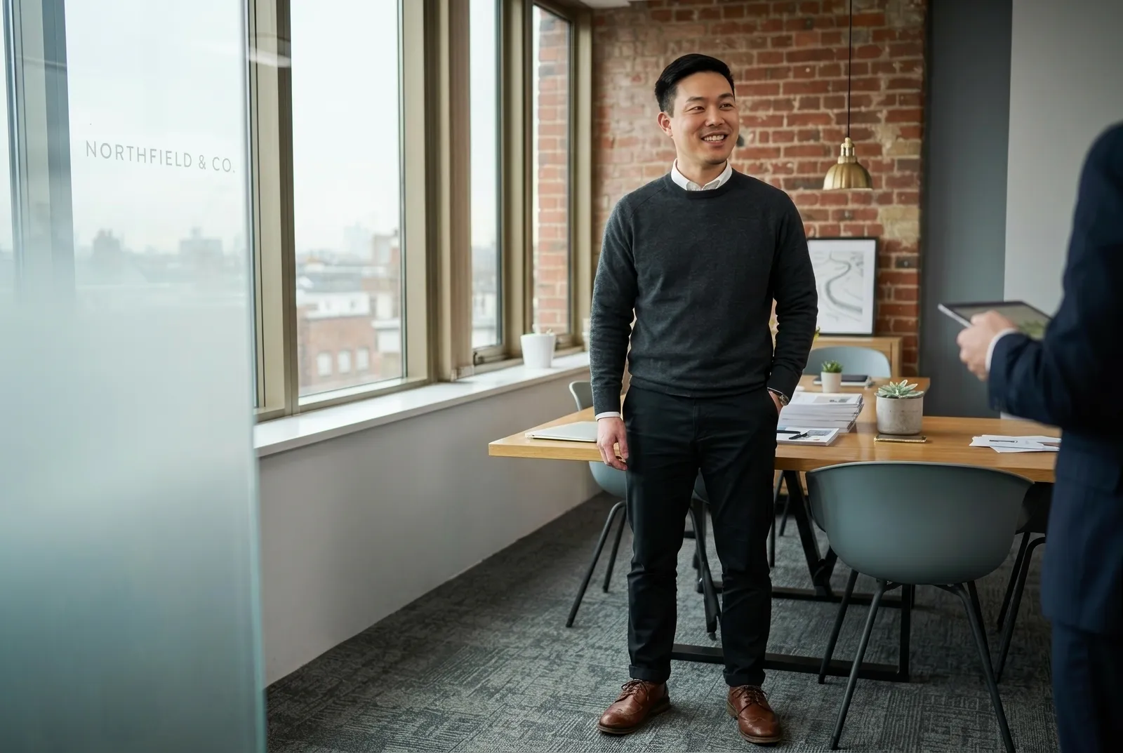 A student standing in a bright office after an online lesson